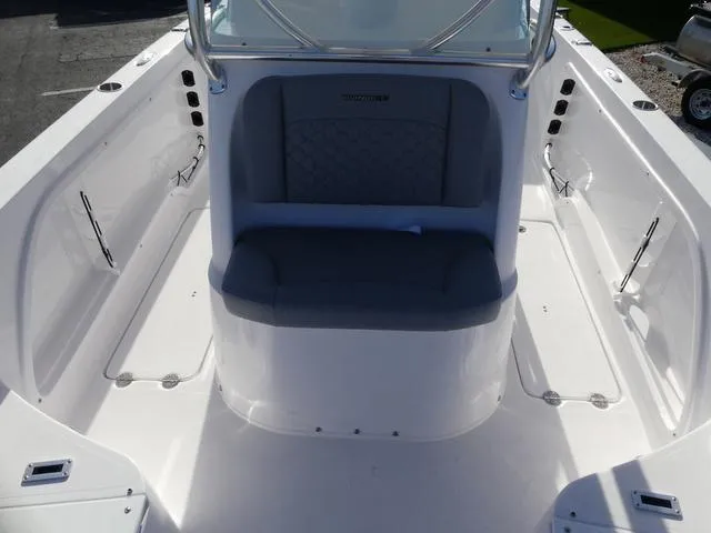 Slide: The Image of 2025 Twin Vee 240 Center Console STX boat, featuring sleek white console design. - 28