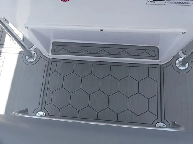 Slide: The Image of 2025 Twin Vee 240 Center Console STX boat on trailer, parked outdoors. - 4