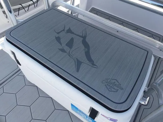 Slide: The Image of 2025 Twin Vee 240 Center Console STX boat interior with steering wheel and seating. - 9