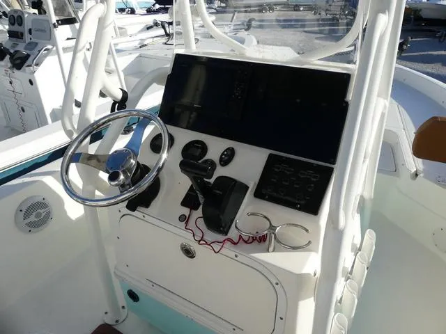 Slide: The Image of 2019 Skeeter SX2250 boat console with steering wheel and control panel. - 10