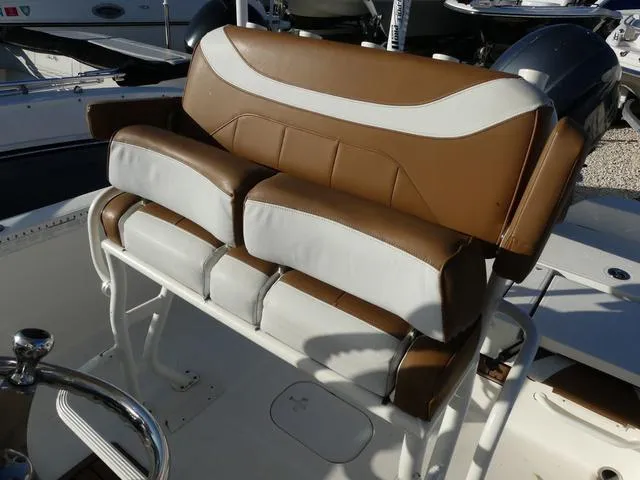 Slide: The Image of 2019 Skeeter SX2250 boat seat with brown and white upholstery. - 13