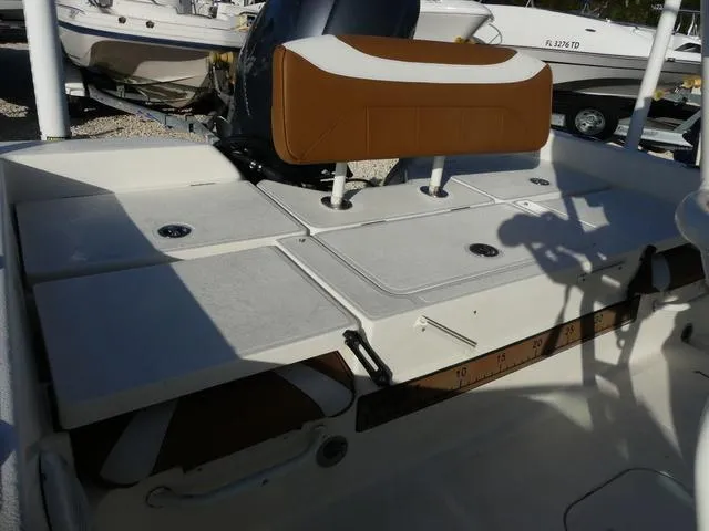 Slide: The Image of 2019 Skeeter SX2250 boat interior with cushioned seating and storage compartments. - 20