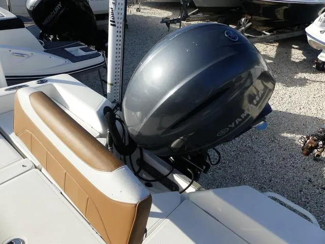 Slide: The Image of 2019 Skeeter SX2250 boat with Yamaha outboard motor, brown seating, and white deck. - 22