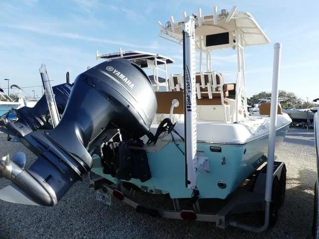 Slide: The Image of 2019 Skeeter SX2250 boat with Yamaha outboard motor, parked on a trailer. - 4
