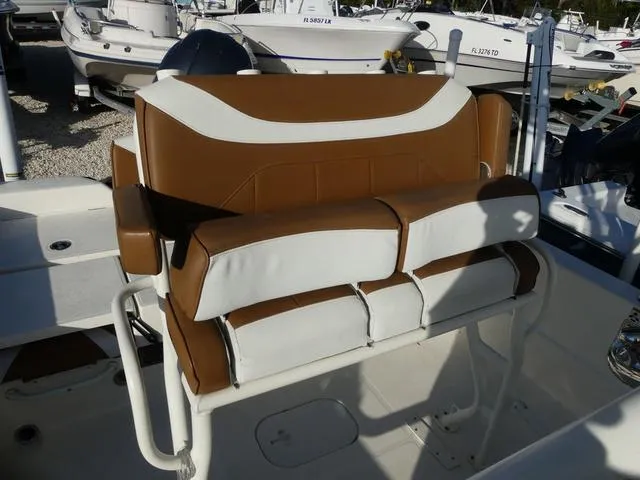 Slide: The Image of Brown and white seating on a 2019 Skeeter SX2250 boat, surrounded by other boats. - 9