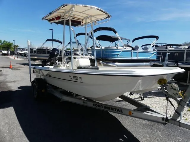 Slide: The Image of 2014 Mako Pro 17 Skiff CC boat on trailer, parked outdoors. - 1