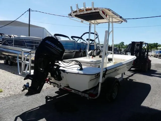 Slide: The Image of 2014 Mako Pro 17 Skiff CC boat with Mercury outboard motor on trailer. - 3