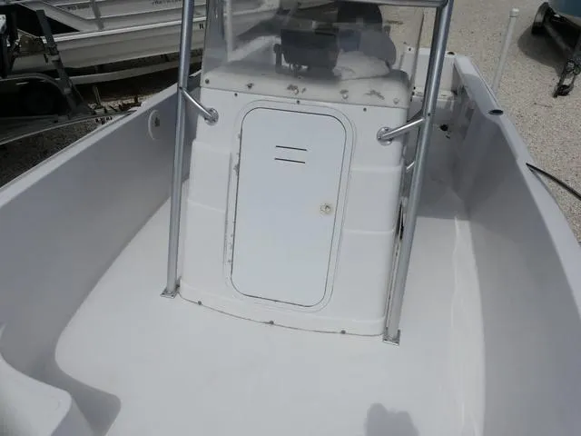 Slide: The Image of 2002 Pro-Line 22 Sport boat interior with center console and storage compartment. - 13