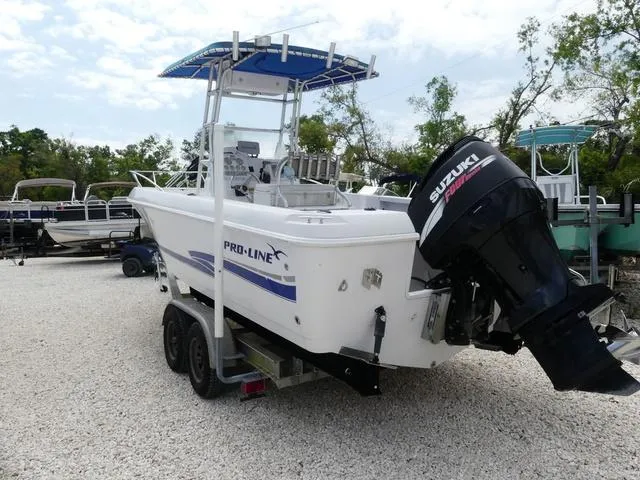 Slide: The Image of 2002 Pro-Line 22 Sport boat with Suzuki outboard motor on a trailer. - 4