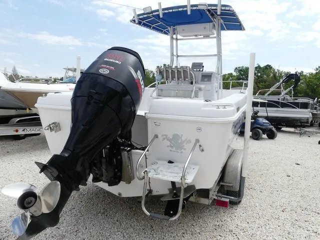 Slide: The Image of 2002 Pro-Line 22 Sport boat with Suzuki outboard motor, parked on gravel. - 6
