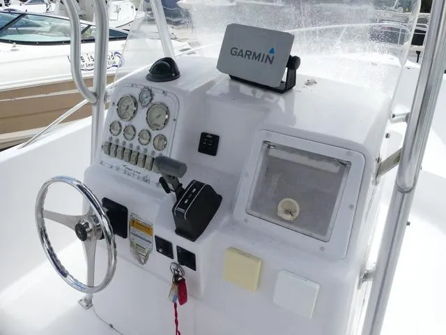 Slide: The Image of 2002 Pro-Line 22 Sport boat dashboard with Garmin navigation system. - 7
