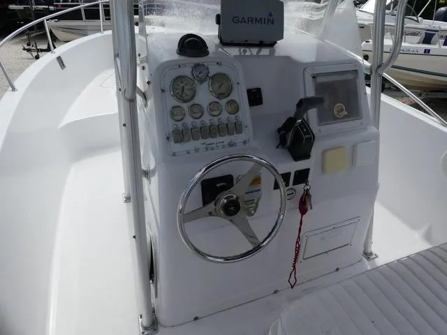 Slide: The Image of 2002 Pro-Line 22 Sport boat dashboard with Garmin navigation system. - 9