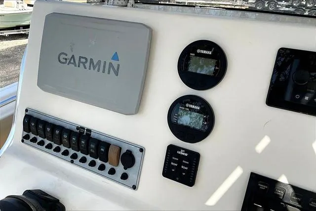 Slide: The Image of Control panel of a 2018 Key West 239FS boat with Garmin and Yamaha displays. - 14