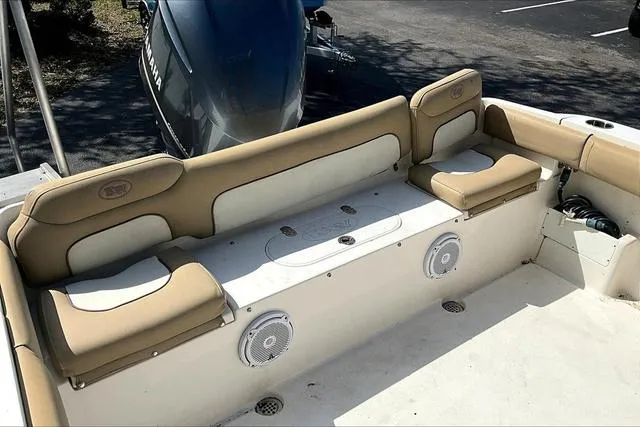 Slide: The Image of 2018 Key West 239FS boat interior with cushioned seating and speakers. - 19