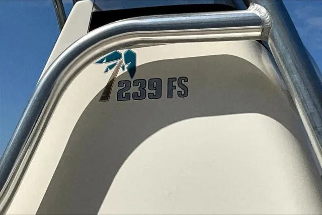 Slide: The Image of 2018 Key West 239FS boat detail with logo and railing against blue sky. - 20
