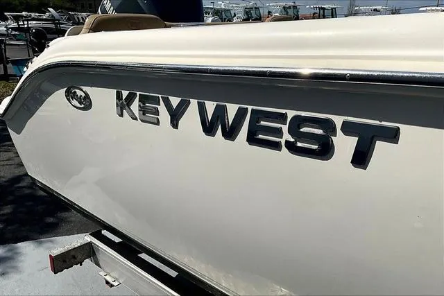 Slide: The Image of 2018 Key West 239FS boat side view with logo in sunlight. - 21
