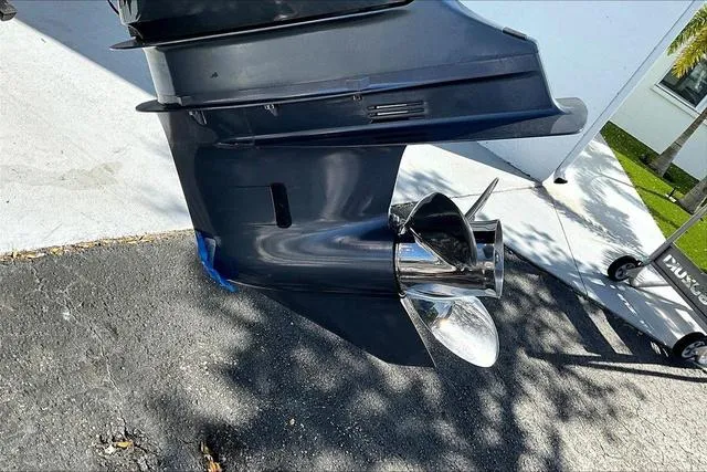 Slide: The Image of 2018 Key West 239FS boat motor and propeller on pavement. - 24