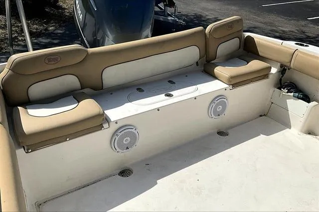 Slide: The Image of 2018 Key West 239FS boat interior with beige seating and built-in speakers. - 26