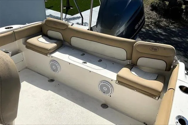 Slide: The Image of 2018 Key West 239FS boat interior with beige seating and built-in speakers. - 27