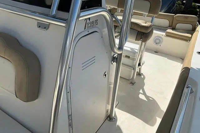 Slide: The Image of 2018 Key West 239FS boat interior with seating and storage compartments. - 31