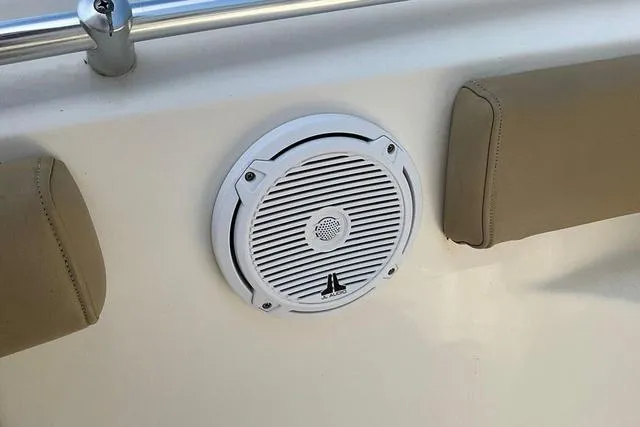 Slide: The Image of Boat speaker on 2018 Key West 239FS, surrounded by beige cushions. - 32