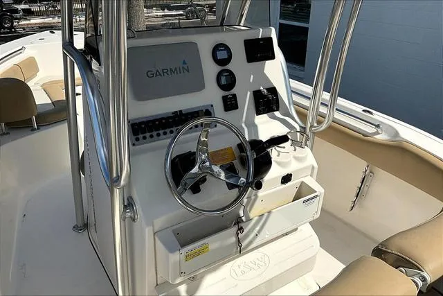 Slide: The Image of 2018 Key West 239FS boat console with Garmin navigation system and steering wheel. - 41