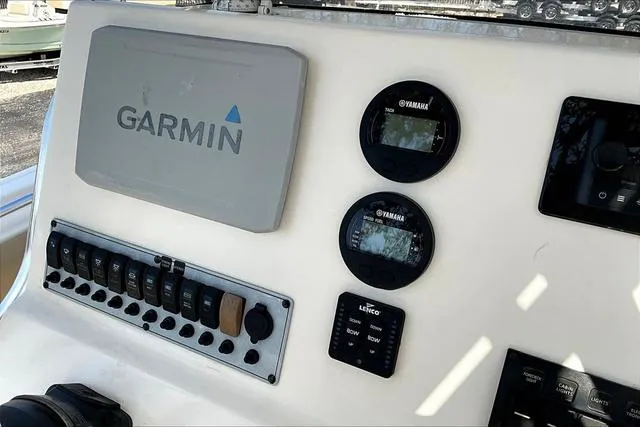 Slide: The Image of Control panel of a 2018 Key West 239FS boat with Garmin and Yamaha displays. - 46
