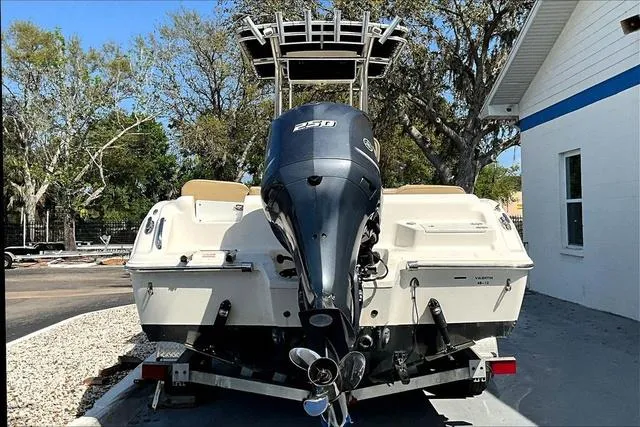 Slide: The Image of 2018 Key West 239FS boat with powerful 250 engine, parked outdoors. - 6