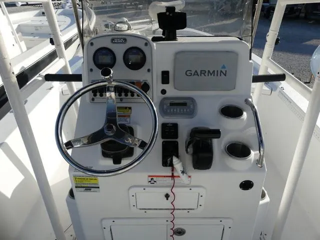Slide: The Image of 2010 Sea Hunt BX 22 Pro boat console with Garmin navigation system and steering wheel. - 10