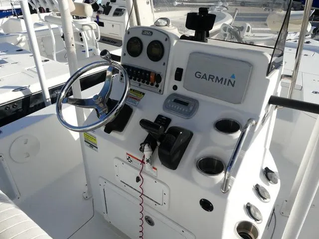 Slide: The Image of 2010 Sea Hunt BX 22 Pro boat console with Garmin navigation system and steering wheel. - 11