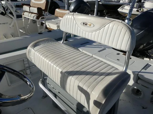Slide: The Image of 2010 Sea Hunt BX 22 Pro boat seat with white upholstery and metal frame. - 13