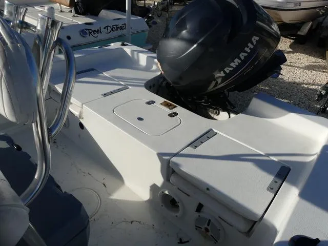 Slide: The Image of 2010 Sea Hunt BX 22 Pro boat with Yamaha outboard motor, featuring spacious deck layout. - 14