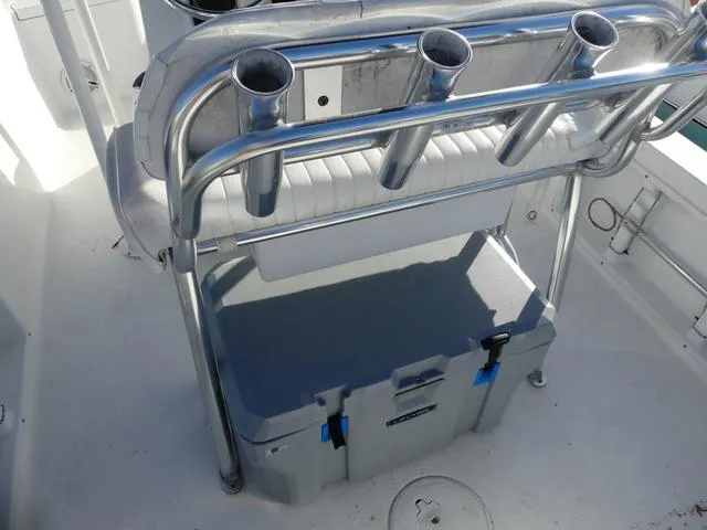 Slide: The Image of 2010 Sea Hunt BX 22 Pro boat with rod holders and storage compartment. - 15