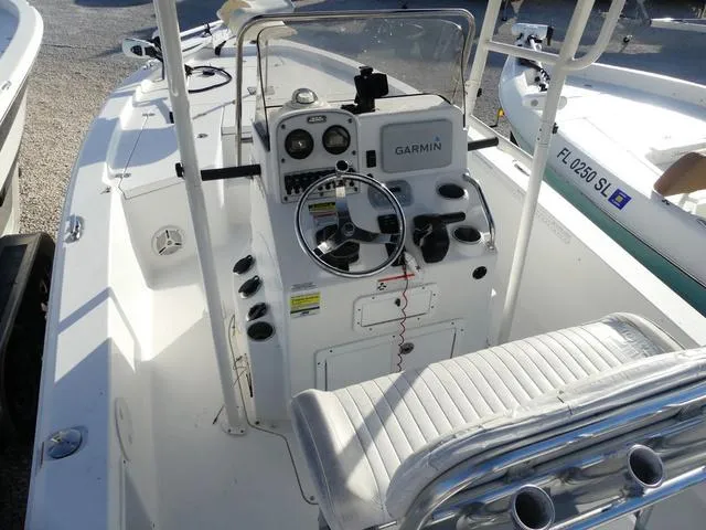 Slide: The Image of 2010 Sea Hunt BX 22 Pro boat cockpit with Garmin navigation system and steering wheel. - 16