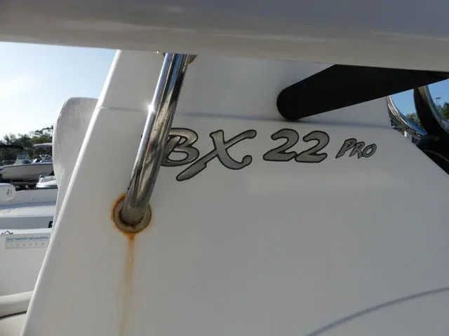 Slide: The Image of 2010 Sea Hunt BX 22 Pro boat detail with logo and railing. - 20
