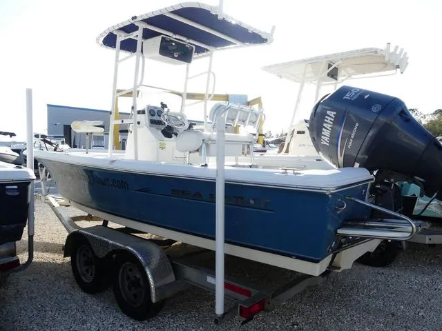 Slide: The Image of 2010 Sea Hunt BX 22 Pro boat on trailer with Yamaha outboard motor. - 4