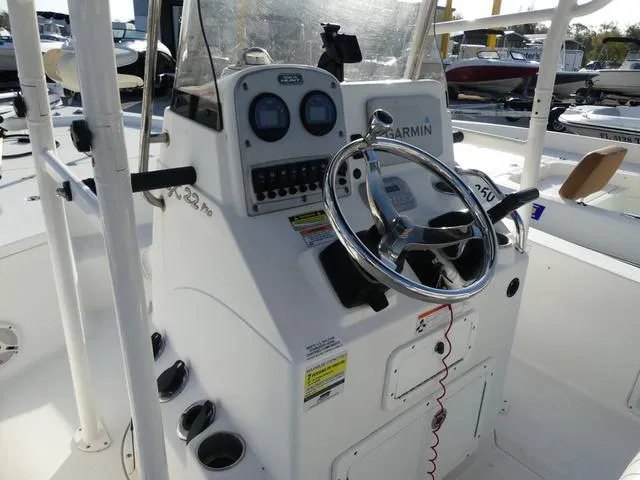 Slide: The Image of 2010 Sea Hunt BX 22 Pro boat console with steering wheel and Garmin navigation system. - 8
