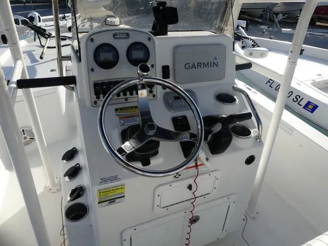 Slide: The Image of 2010 Sea Hunt BX 22 Pro boat console with Garmin navigation system and steering wheel. - 9