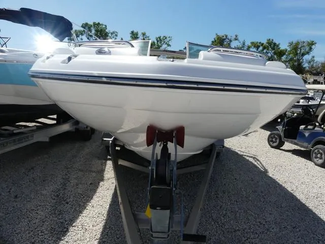 Slide: The Image of 2018 Hurricane SD 2200 OB boat on trailer, parked on gravel, sunny day. - 19
