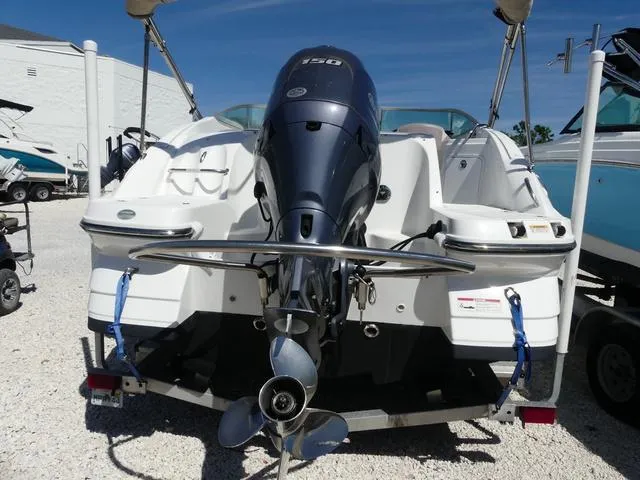 Slide: The Image of 2018 Hurricane SD 2200 OB boat with outboard motor, parked on a trailer. - 23