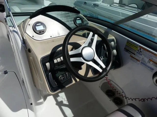 Slide: The Image of 2018 Hurricane SD 2200 OB boat dashboard with steering wheel and controls. - 25