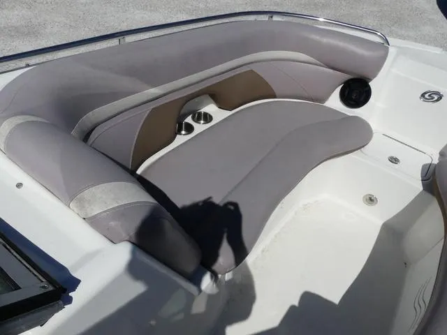 Slide: The Image of 2018 Hurricane SD 2200 OB boat interior with cushioned seating and cup holders. - 30