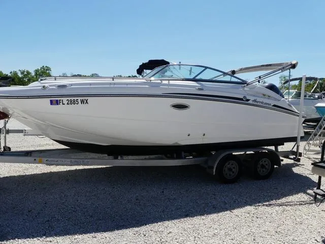 Slide: The Image of 2018 Hurricane SD 2200 OB boat on trailer, white exterior, parked on gravel. - 4
