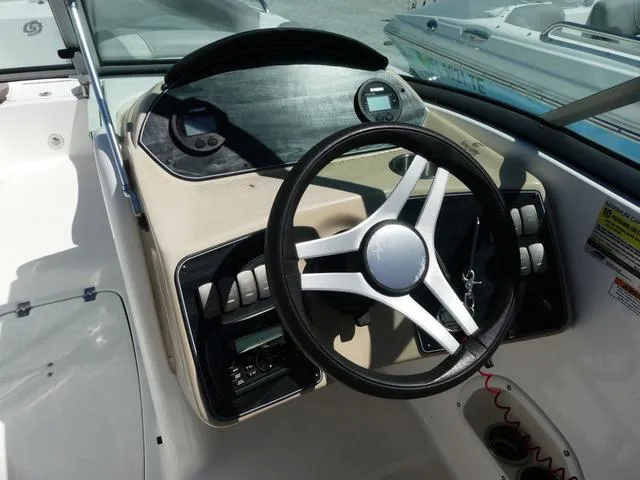 Slide: The Image of 2018 Hurricane SD 2200 OB boat dashboard with steering wheel and control panel. - 8