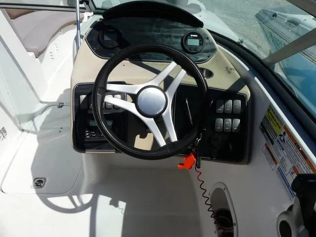 Slide: The Image of 2018 Hurricane SD 2200 OB boat dashboard with steering wheel and control panel. - 9