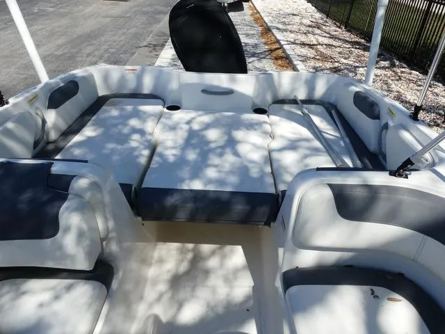Slide: The Image of 2019 Bayliner Element E18 boat interior with spacious seating and modern design. - 7