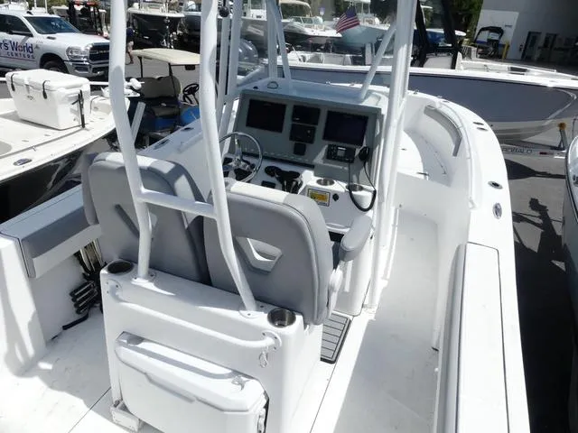 Slide: The Image of 2021 Release 240 RX boat interior with dual seats and modern dashboard controls. - 7