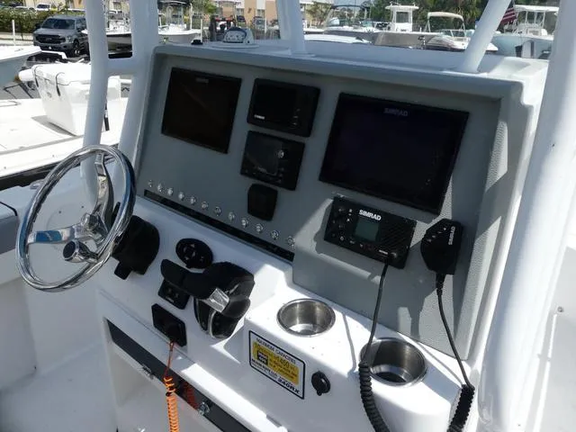 Slide: The Image of Control panel of a 2021 Release 240 RX boat with navigation equipment. - 8