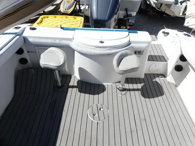 Slide: The Image of 2002 Seaswirl Striper 2301 boat interior with seating and storage compartments. - 15
