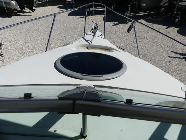 Slide: The Image of 2002 Seaswirl Striper 2301 boat deck with circular hatch and railing. - 16